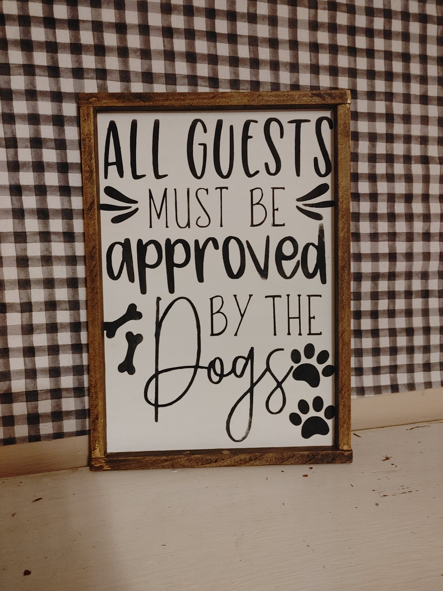 All guests must be approved by the dogs Sign