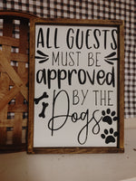 All guests must be approved by the dogs Sign