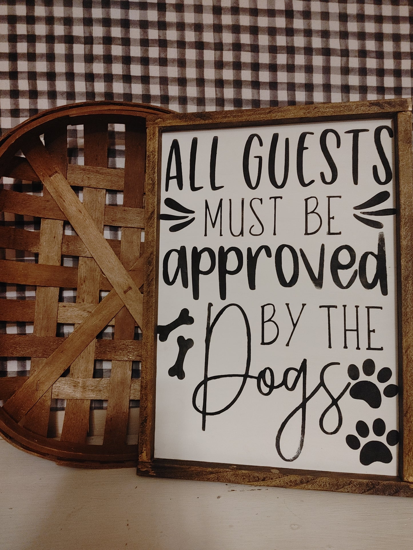 All guests must be approved by the dogs Sign