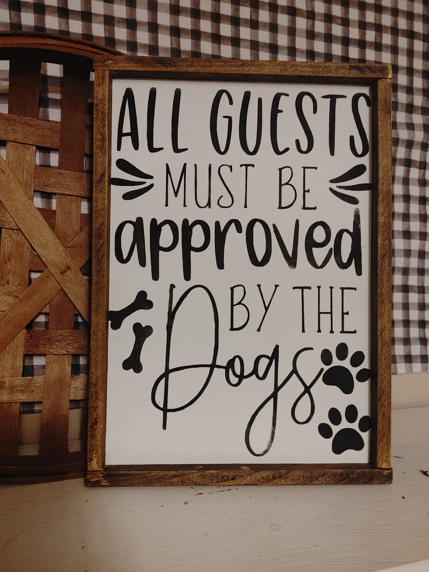 All guests must be approved by the dogs Sign