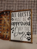 All guests must be approved by the dogs Sign