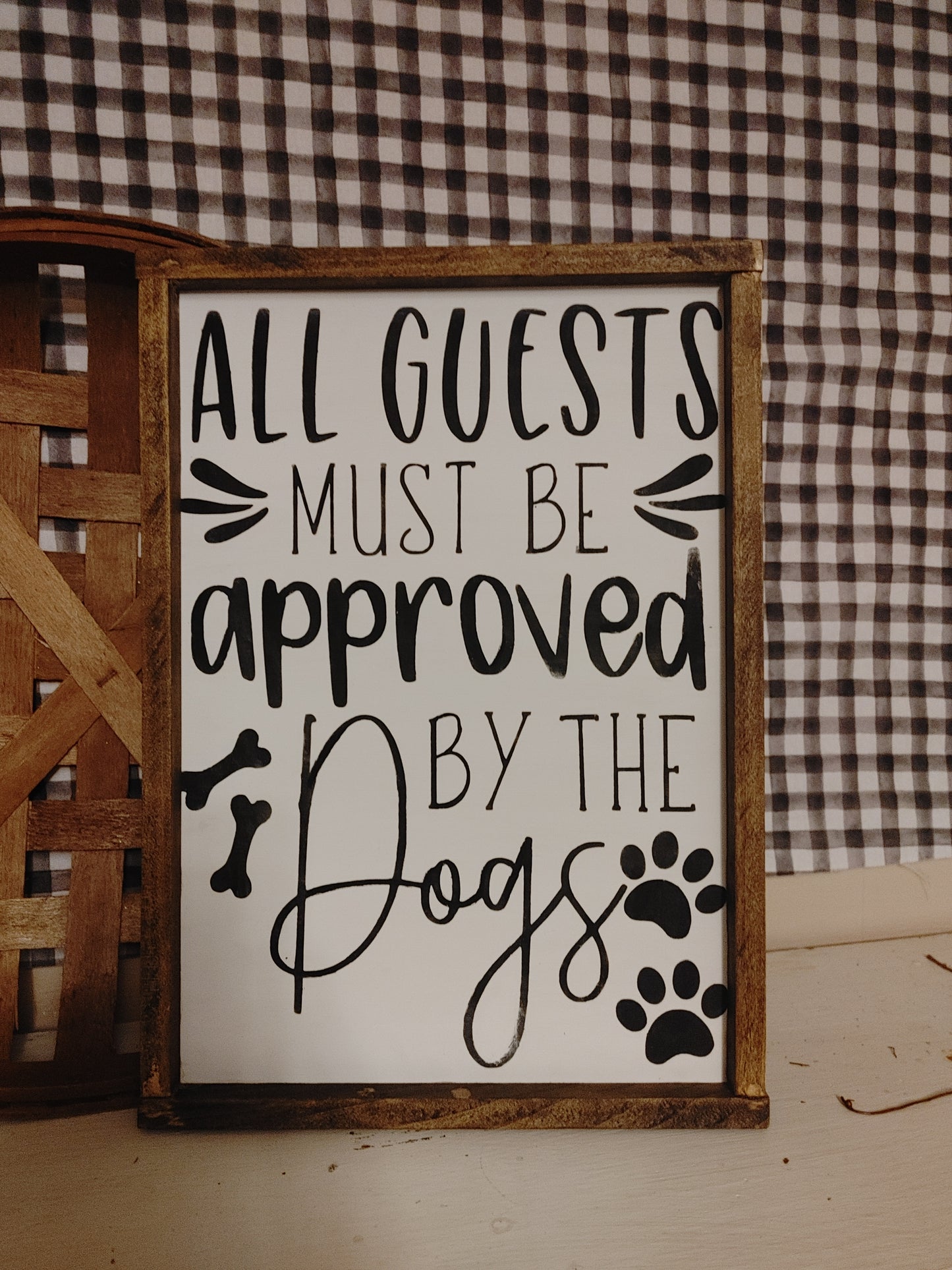 All guests must be approved by the dogs Sign