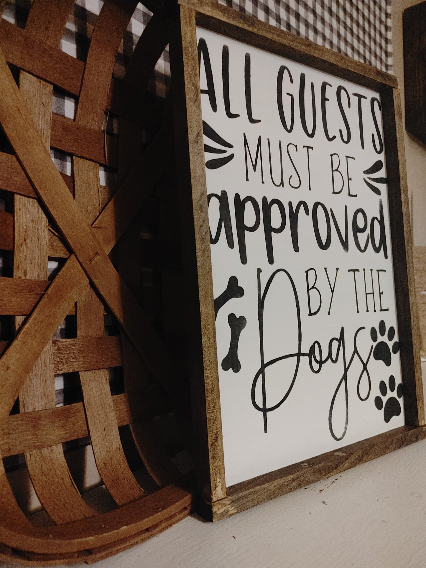 All guests must be approved by the dogs Sign