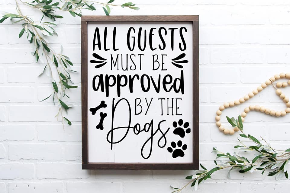 All guests must be approved by the dogs Sign